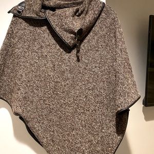 Brown cape with buckle detail